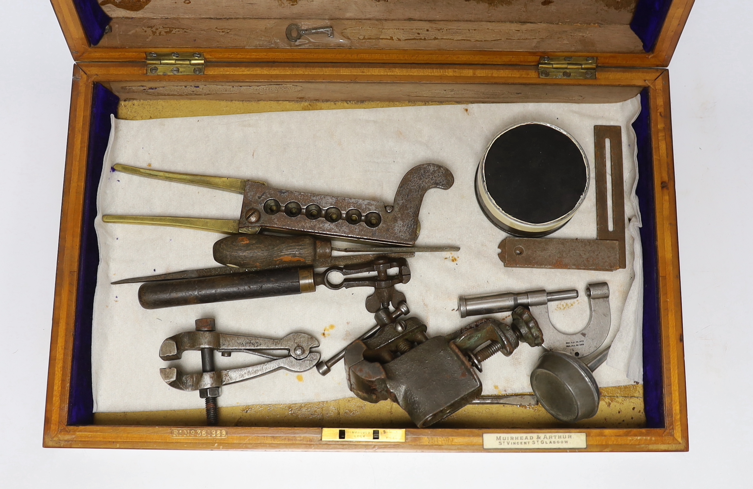 Two mahogany boxes of gun tools, including; bullet moulds, files, a vice, musket balls, etc.